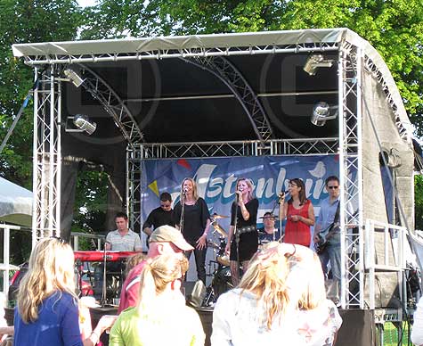 Small covered stage for summer music festival.