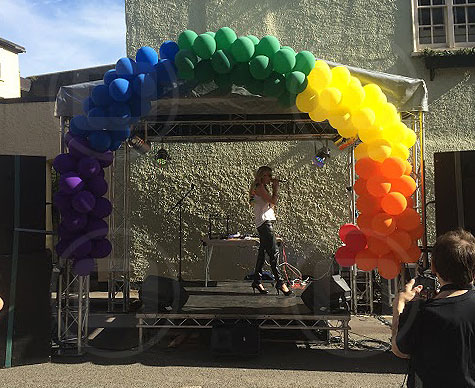 Small covered stage for street event.